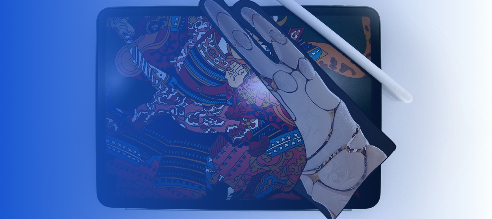 A stylus and and artse glove printed predesigned with a skeletal hand pattern rest on top of a tablet