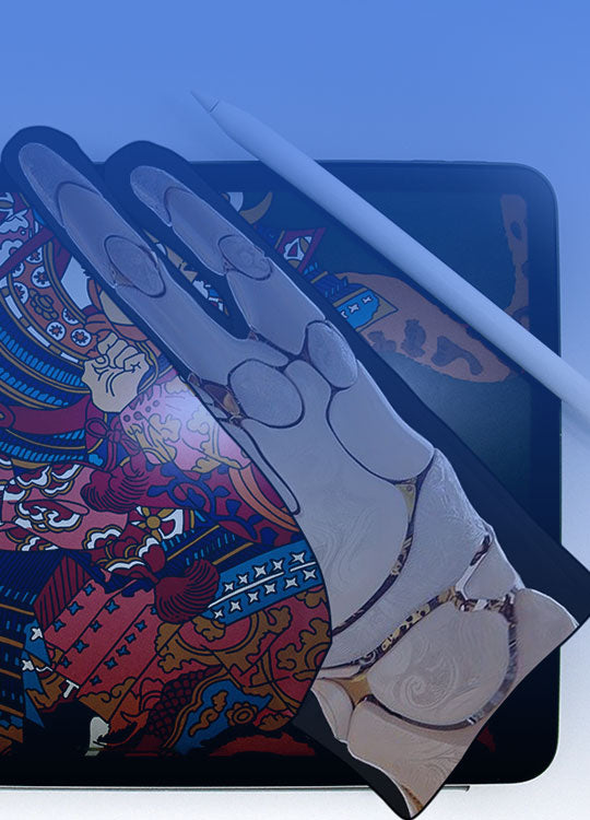 A stylus and and artse glove printed predesigned with a skeletal hand pattern rest on top of a tablet