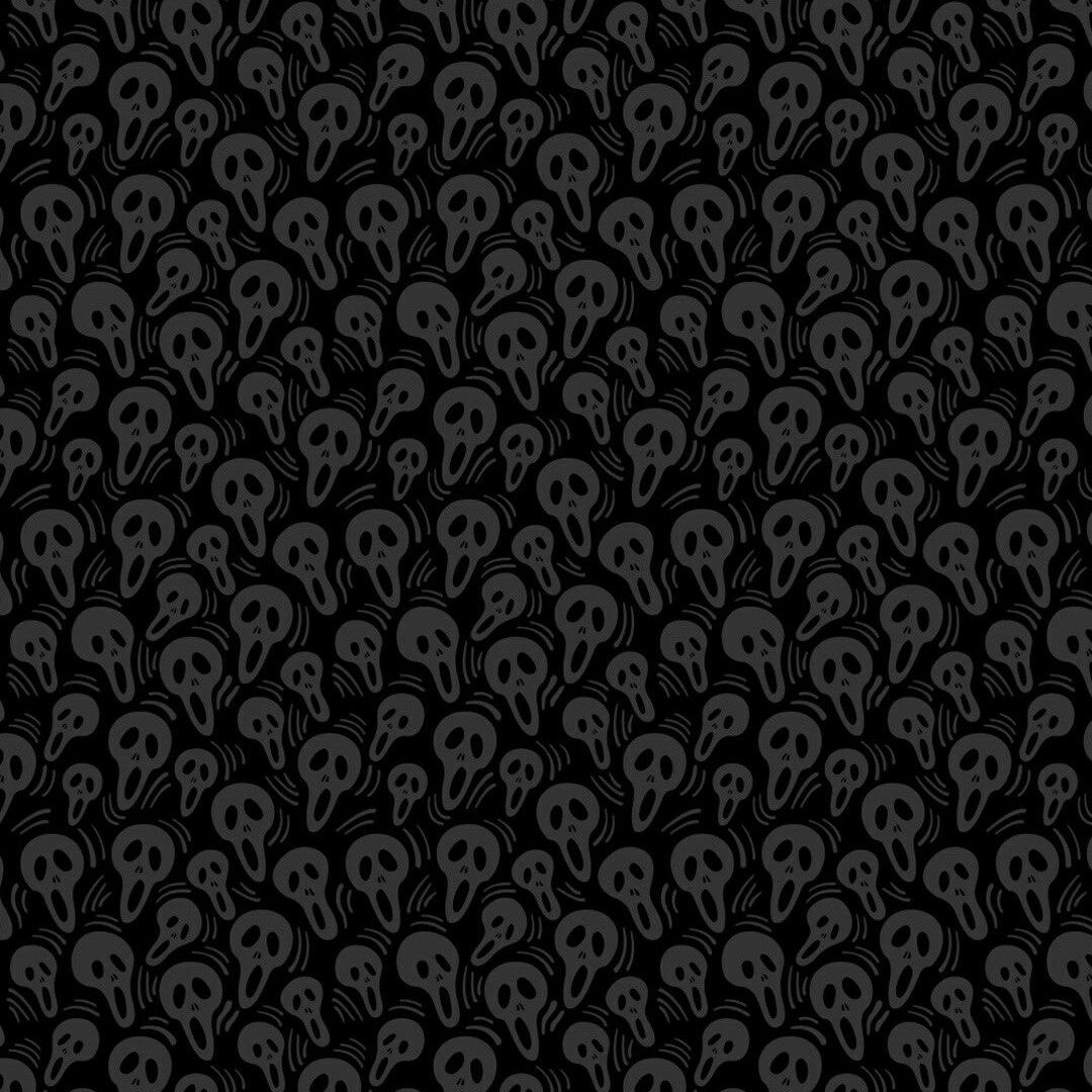 Pattern of black skulls on a black background